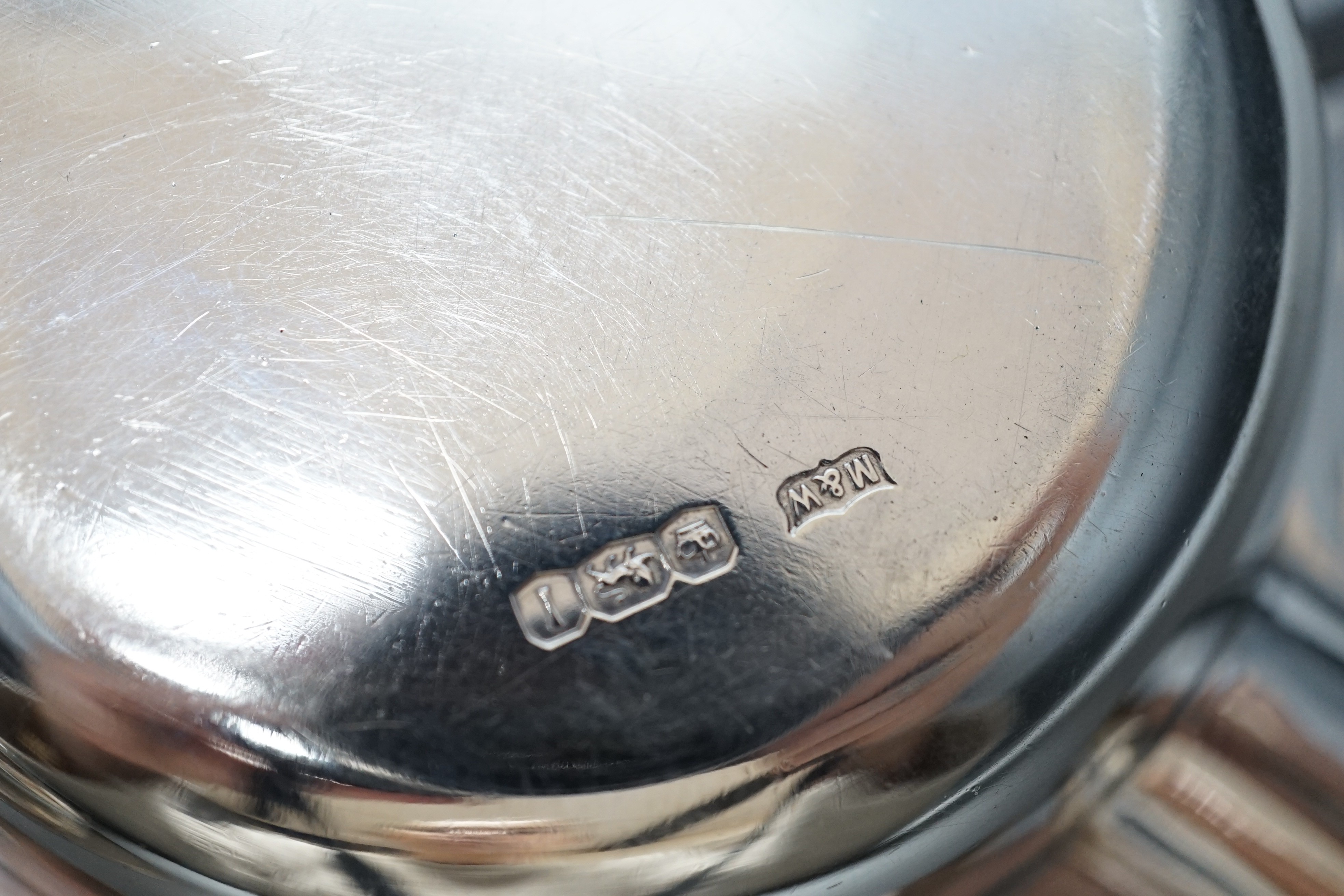 A George V silver ashtray, Mappin & Webb, Sheffield, 1928, 13cm, a modern Asprey & Co small dish and a continental white metal box and cover, gross 12.2oz.